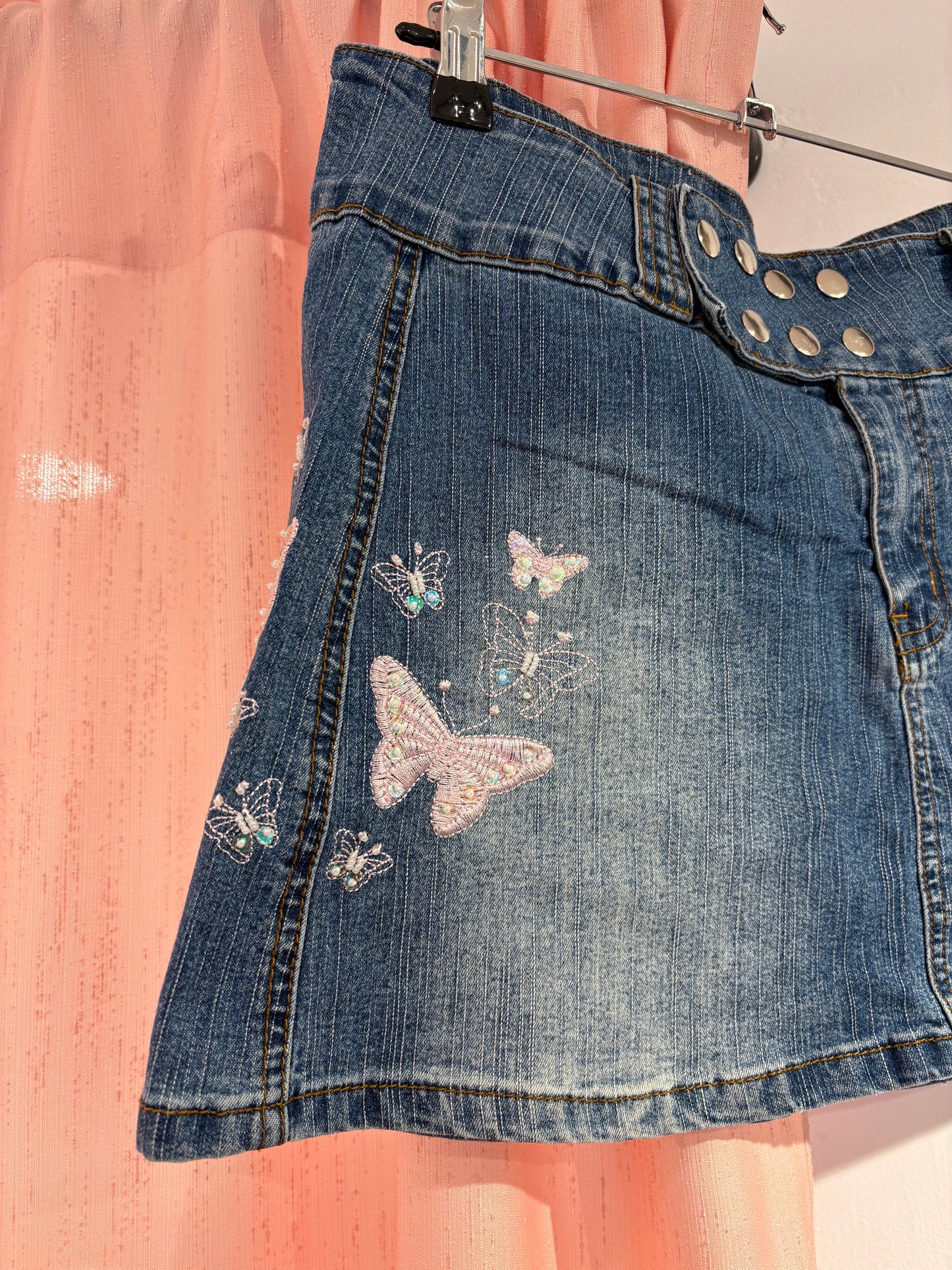Denim mini skirt with playful butterfly print & statement button details (M)