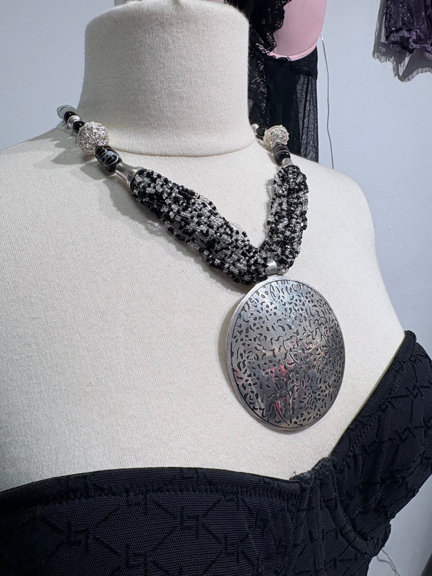 Vintage black necklace with large silver pendant