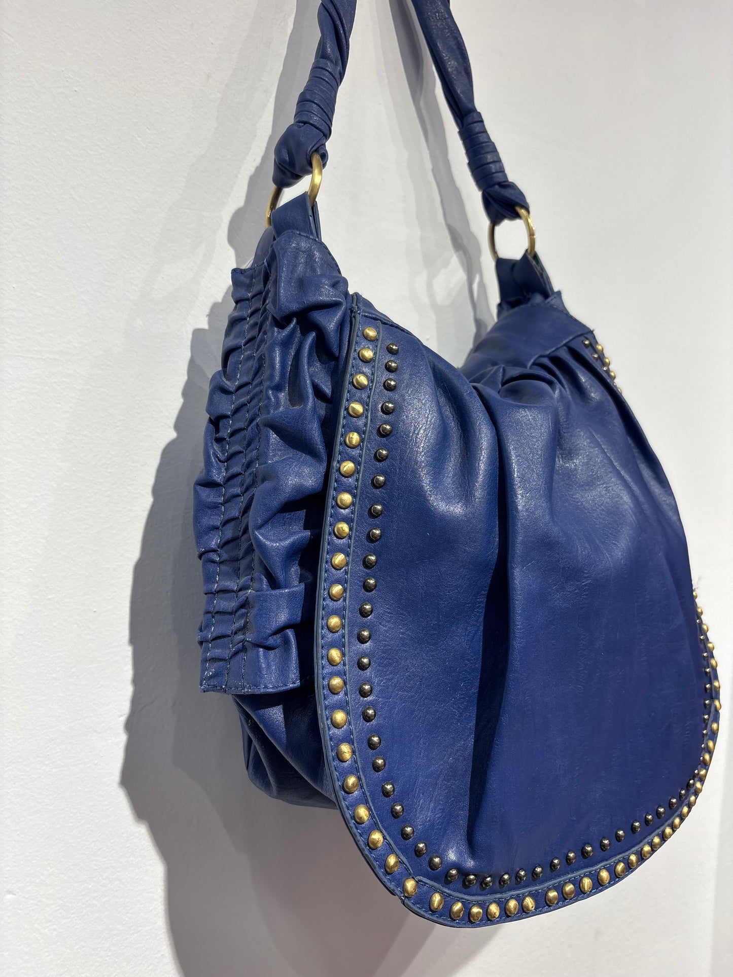 Electric blue bag with metal studs